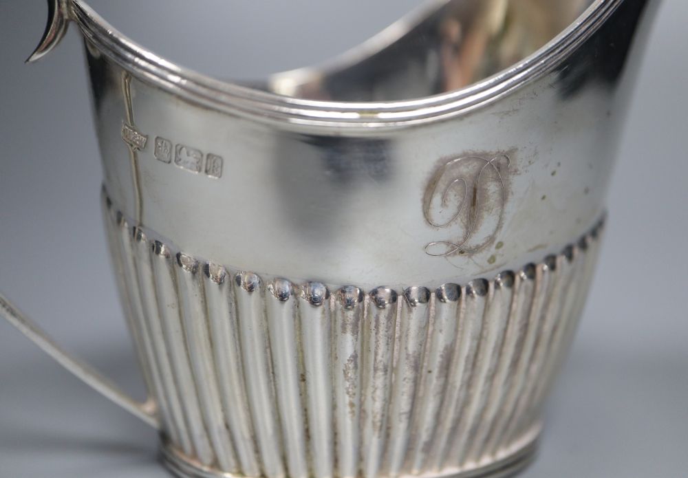 An Edwardian four piece demi-fluted oval silver tea and coffee set, Mappin & Webb, Sheffield, 1902, gross 38oz.